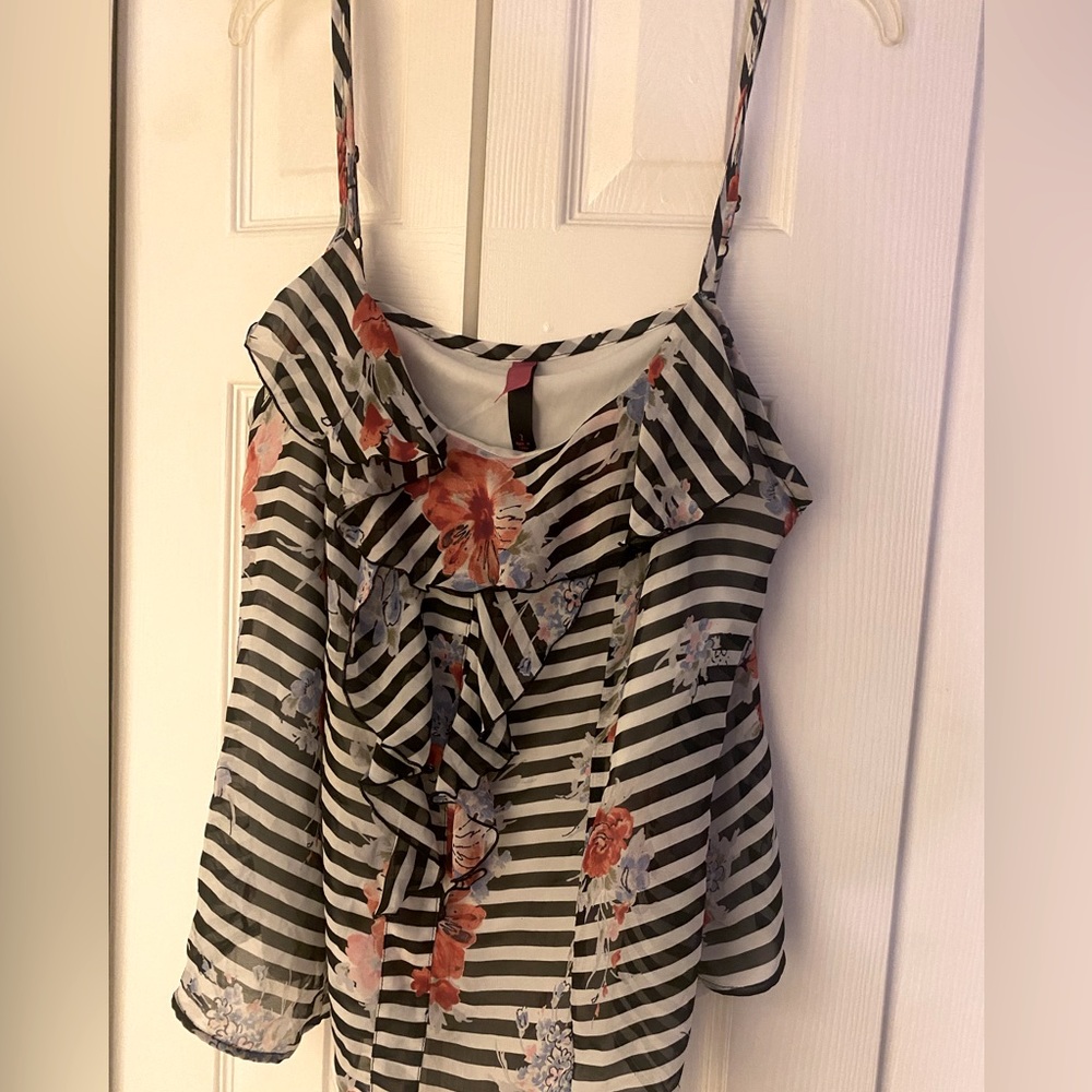 Women’s multi color shirt. The layer underneath is white.